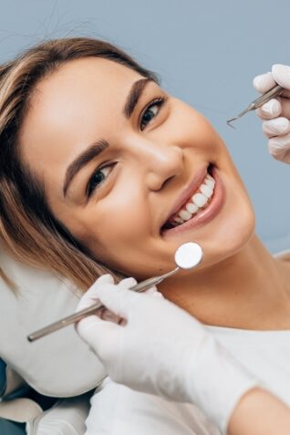 Woman smiling during dental checkup