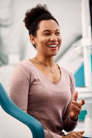 Woman grinning in dental chair