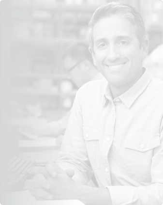 Smiling man sitting at table