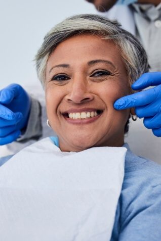 Woman grinning in dental chair